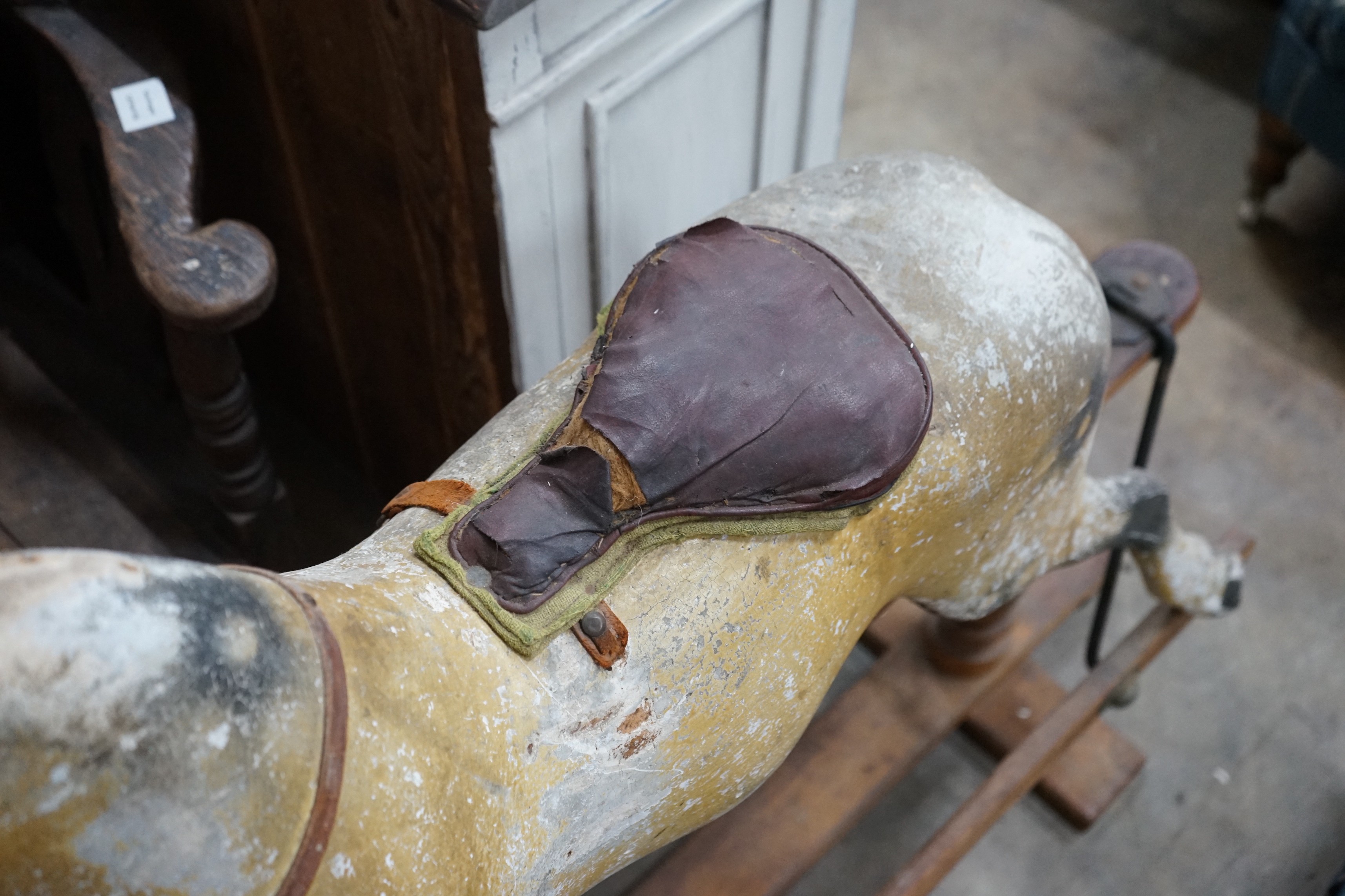 A vintage Tri-Ang rocking horse on pine safety frame, length 132cm, height 112cm